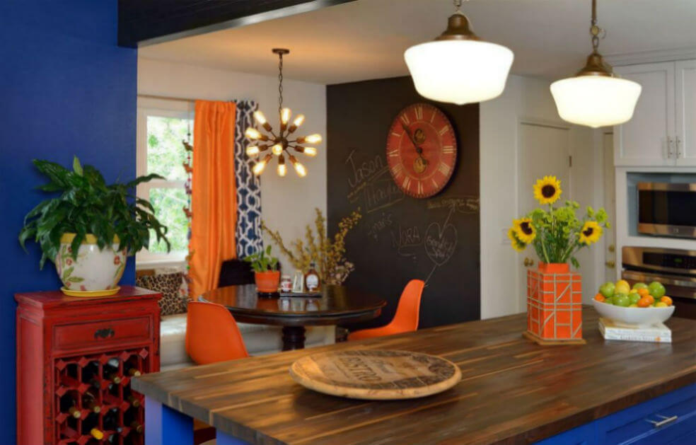 A kitchen with orange and blue accents