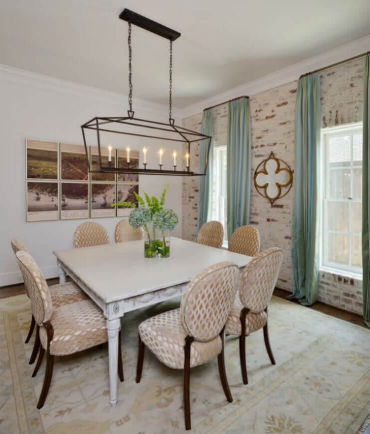 A dining table with a candle chandelier