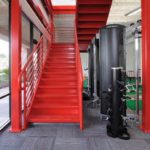 A red color stair inside a luxury gym